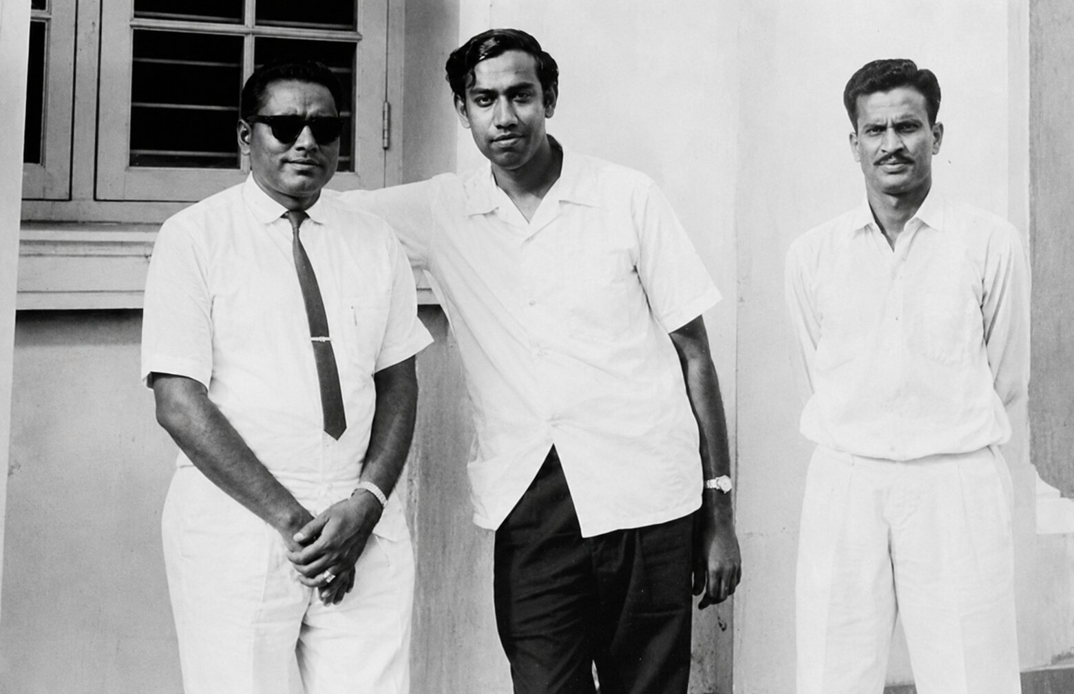 Dr. Rajendran with his first clinical team in the early years of the practice